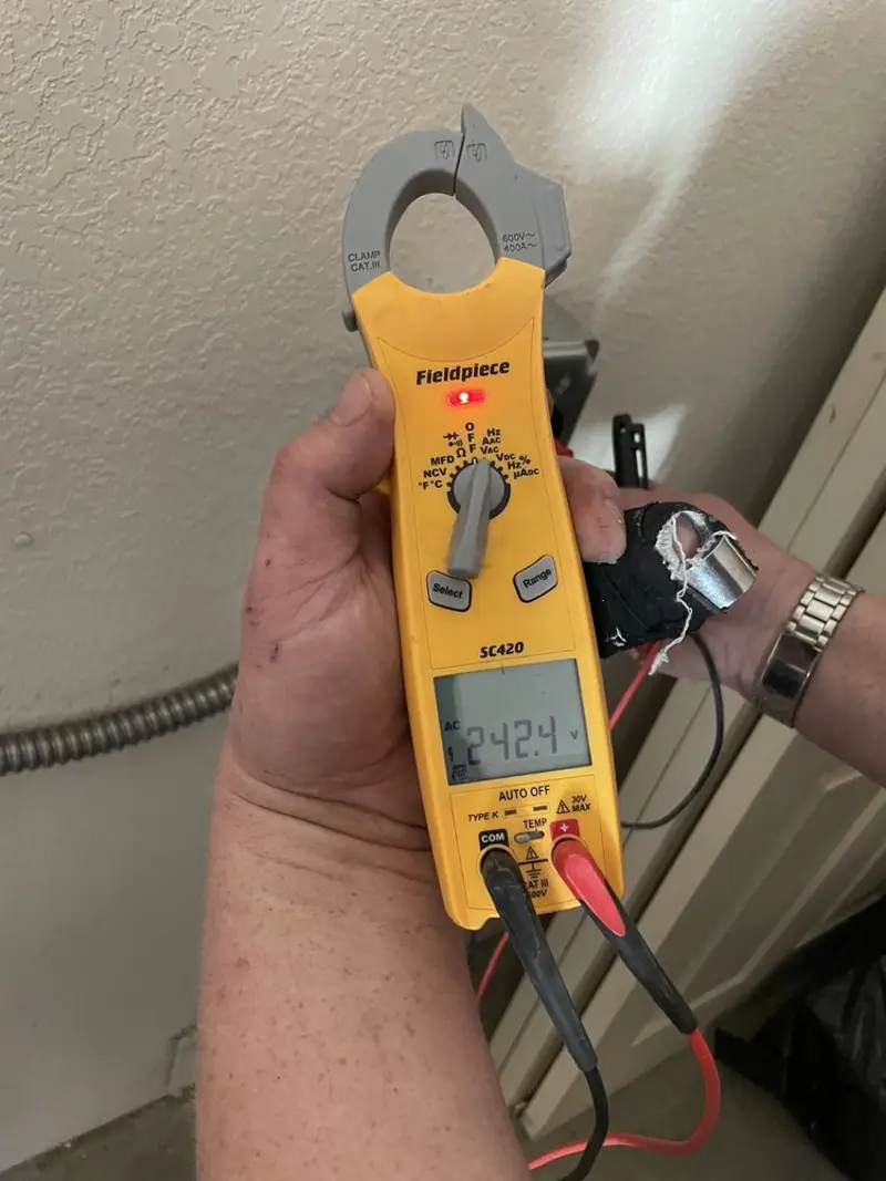 Voltage testing with clamp meter during Recessed Lighting Installation in Lone Tree